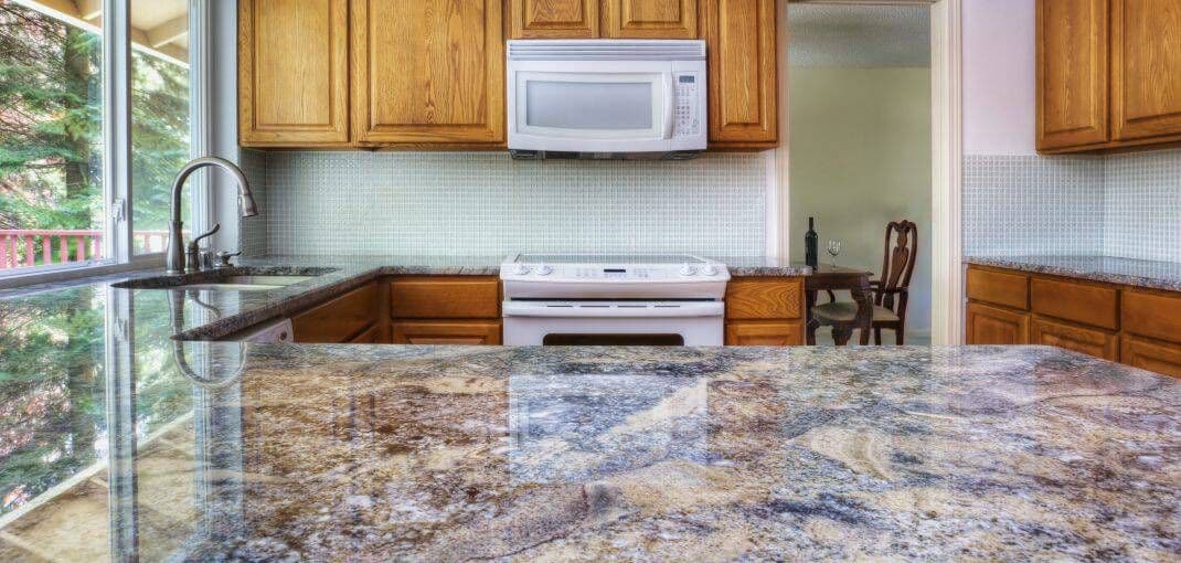 granite-counter-reflecting-kitchen-cabinets